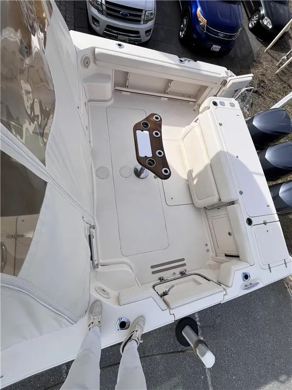 Slide: The Image of 2015 Grady-White Express 370 boat deck, aerial view, with seating and rod holders. - 9