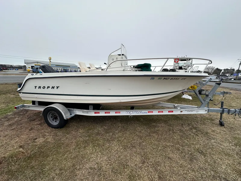 The Image of 2001 Trophy 1903 Center Console boat on trailer, side view. - 0