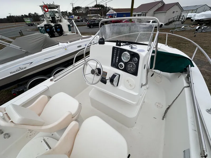 Slide: The Image of 2001 Trophy 1903 Center Console boat interior with steering wheel and gauges. - 3