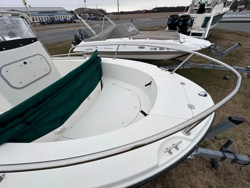 Slide: The Image of 2001 Trophy 1903 Center Console boat on trailer, parked outdoors. - 4