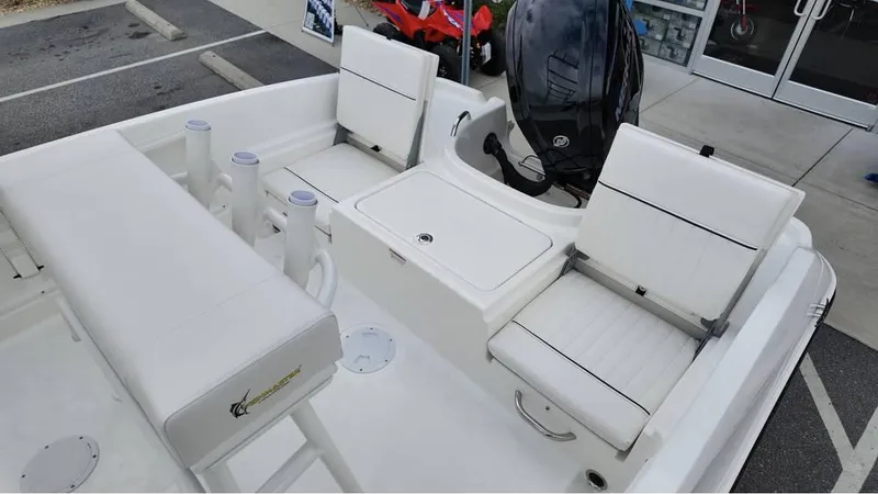 Slide: The Image of 2025 Bayliner T18 Limited Edition boat interior with white seating and storage compartments. - 10