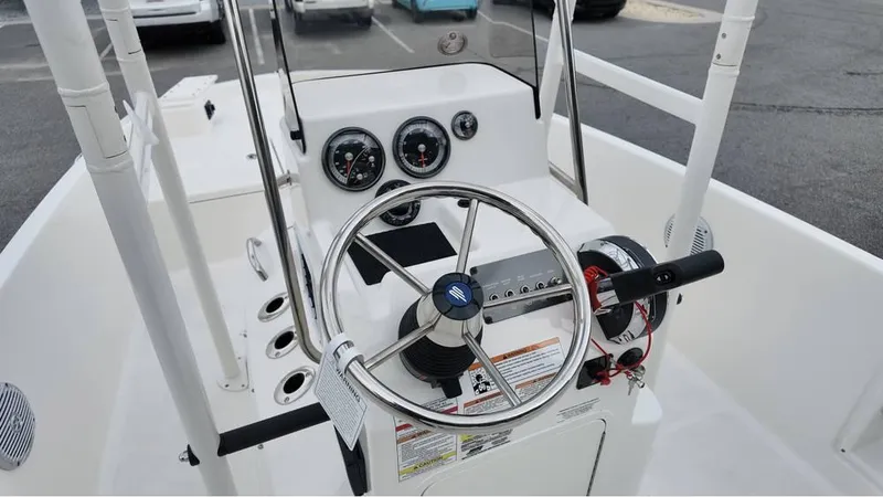 Slide: The Image of 2025 Bayliner T18 Limited Edition boat dashboard with steering wheel and gauges. - 11
