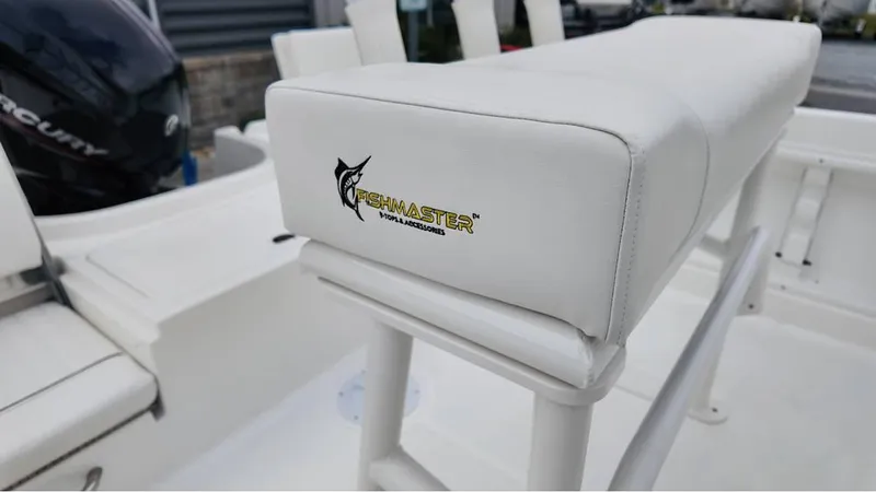 Slide: The Image of 2025 Bayliner T18 Limited Edition boat seat with Fishmaster logo, white upholstery. - 16