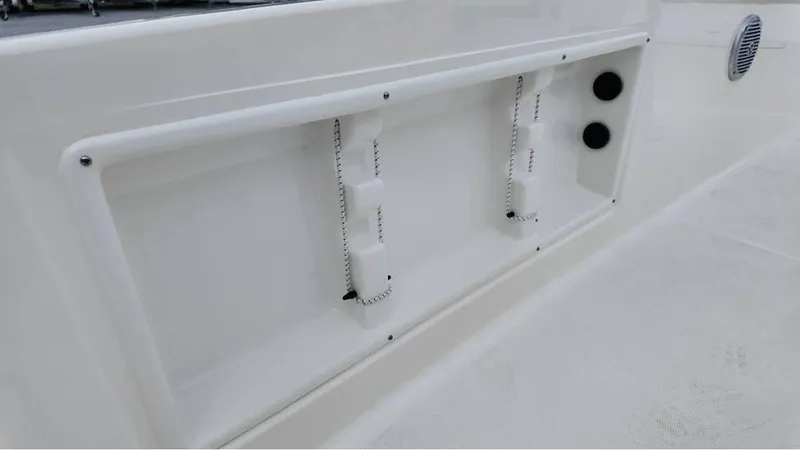 Slide: The Image of 2025 Bayliner T18 Limited Edition boat interior detail with white panel and fixtures. - 18