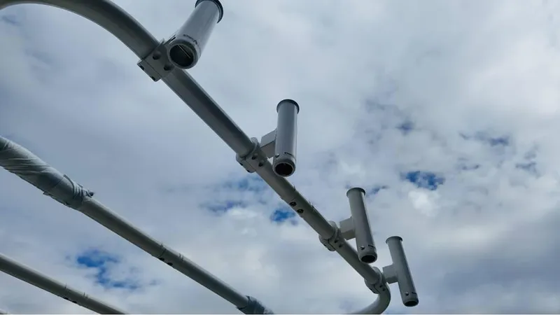 Slide: The Image of Fishing rod holders on Bayliner T18 Limited Edition 2025 against cloudy sky. - 21