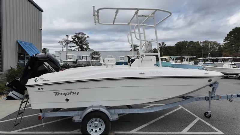 Slide: The Image of 2025 Bayliner T18 Limited Edition boat on trailer, parked outdoors. - 3