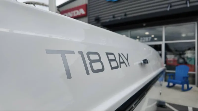 Slide: The Image of 2025 Bayliner T18 Limited Edition boat close-up at dealership. - 8