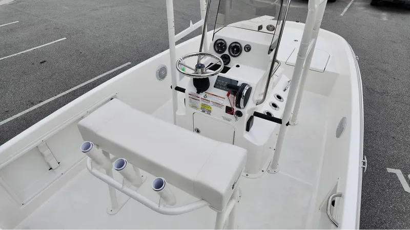 Slide: The Image of 2025 Bayliner T18 Limited Edition boat interior with steering console and seating. - 9