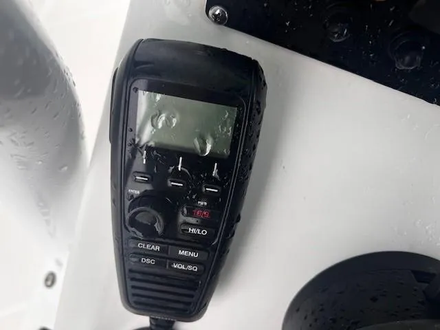 Slide: The Image of Close-up of a marine radio on a 2021 Blackfin 252 CC boat. - 11
