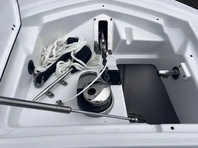 Slide: The Image of Anchor compartment of 2021 Blackfin 252 CC boat with ropes and winch. - 12