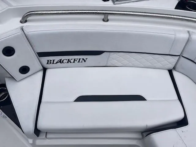 Slide: The Image of 2021 Blackfin 252 CC boat seating with white upholstery and logo detail. - 15