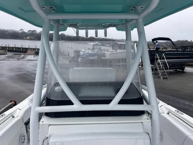 Slide: The Image of 2021 Blackfin 252 CC boat with wet windshield at dockside. - 17