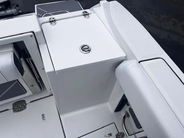 Slide: The Image of 2021 Blackfin 252 CC boat interior, featuring storage compartments and seating area. - 7