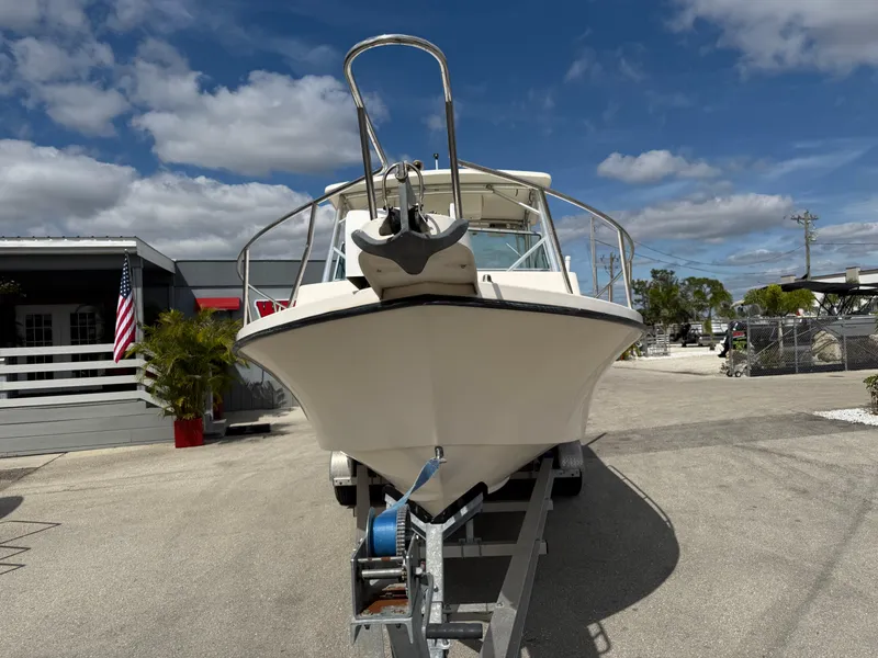 Slide: The Image of 2005 Parker 2510 Deep Vee Walkaround boat on trailer under blue sky. - 4
