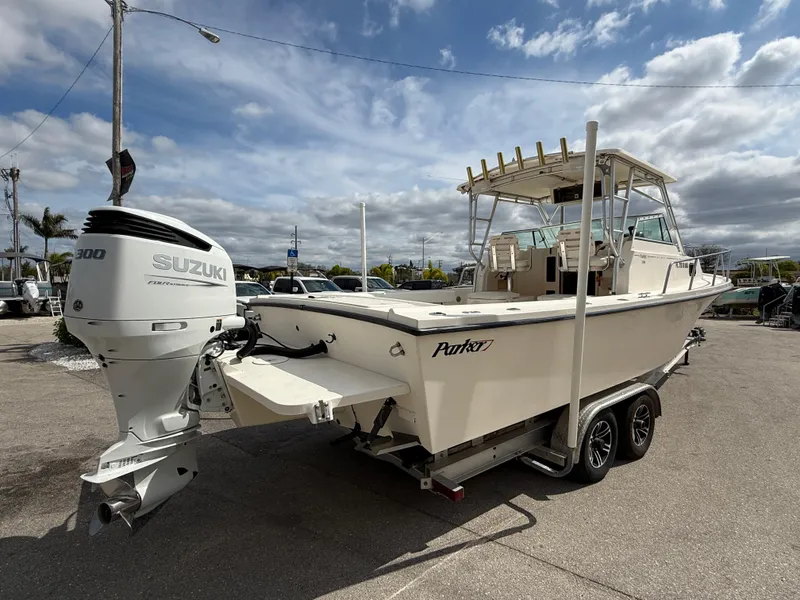 Slide: The Image of 2005 Parker 2510 Deep Vee Walkaround boat with Suzuki engine on trailer. - 6