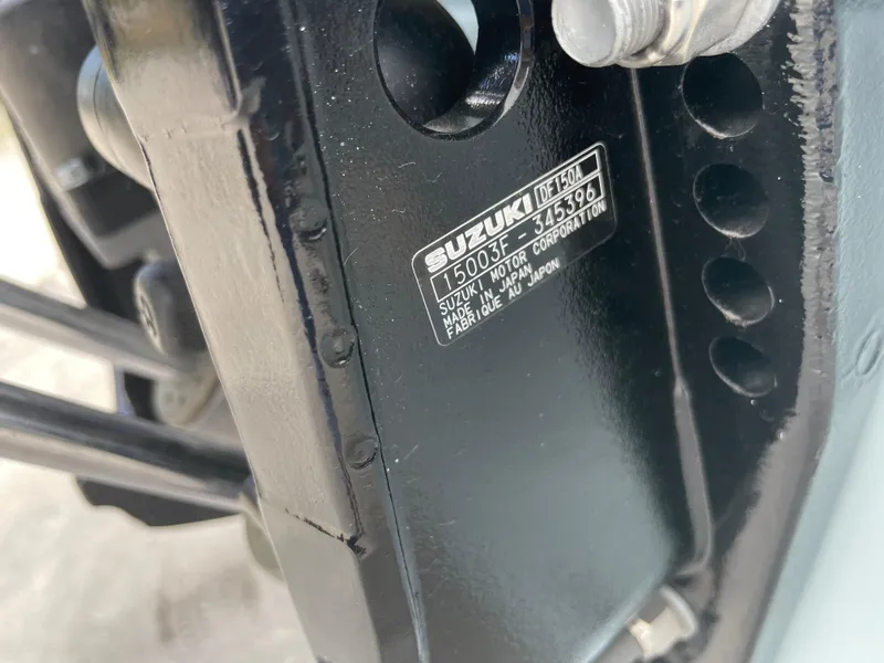 Slide: The Image of Close-up of a Suzuki engine part with identification plate, Savannah 210X 2025 model. - 10