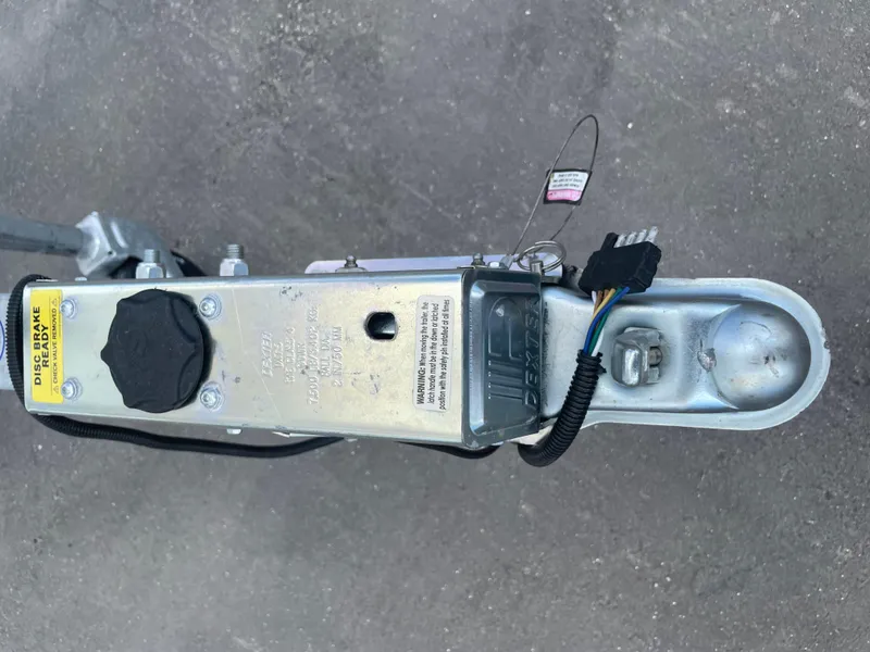 Slide: The Image of Trailer hitch assembly of a 2025 Savannah 210X on a concrete surface. - 21