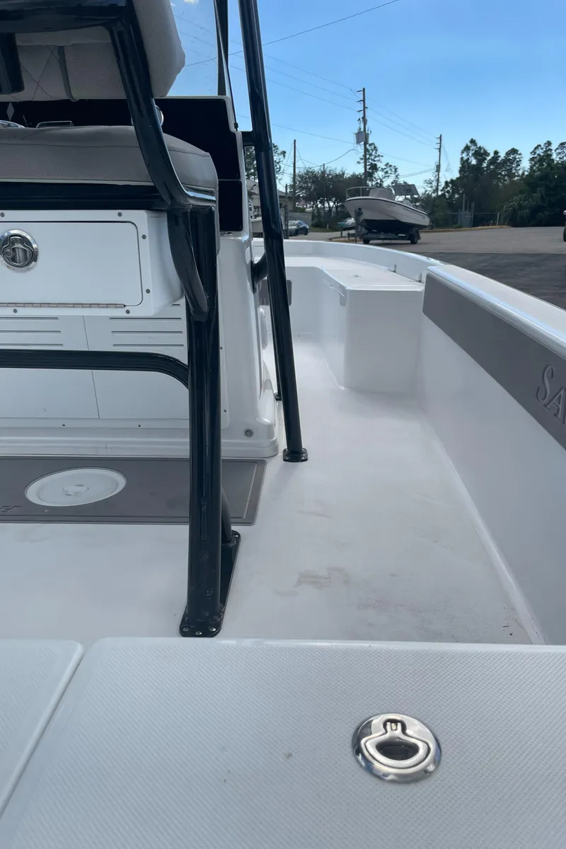 Slide: The Image of 2025 Savannah 210X boat interior, showcasing seating and deck details. - 26