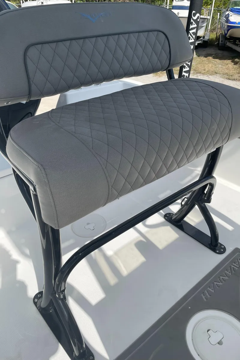Slide: The Image of Gray quilted seat on 2025 Savannah 210X boat, featuring sturdy black frame. - 29