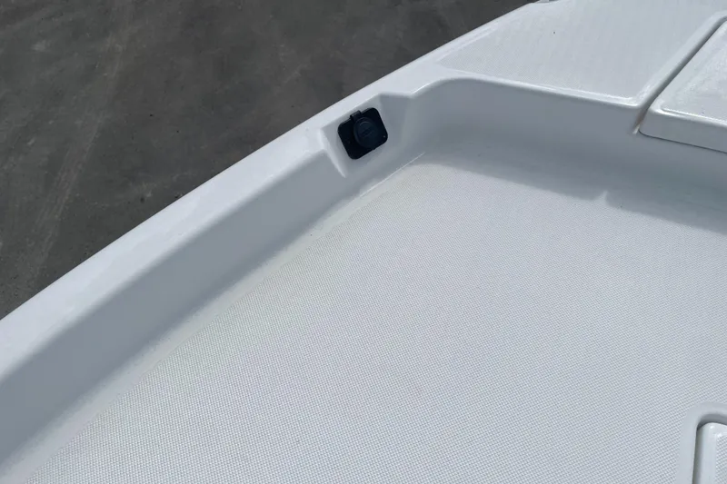 Slide: The Image of 2025 Savannah 210X boat deck with textured surface and embedded fixture. - 31