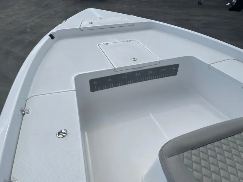 Slide: The Image of 2025 Savannah 210X boat interior with storage compartments and seating. - 5