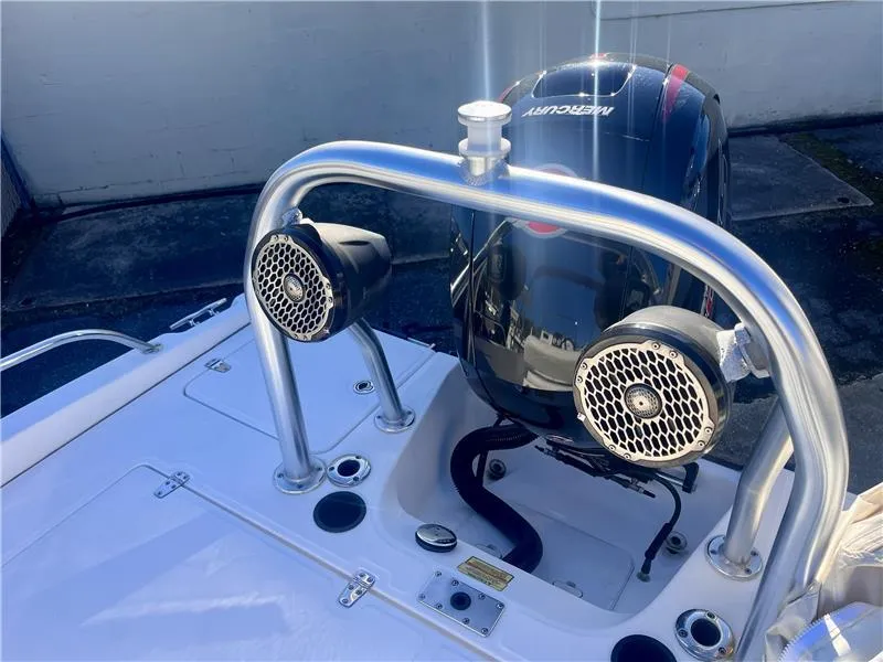 Slide: The Image of 2008 Boston Whaler 180 Dauntless boat with Mercury engine and mounted speakers. - 9