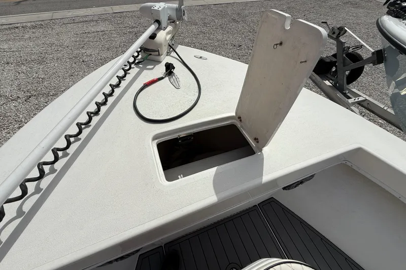 Slide: The Image of 2021 C-Hawk 25 Center Console boat with open storage compartment on deck. - 19