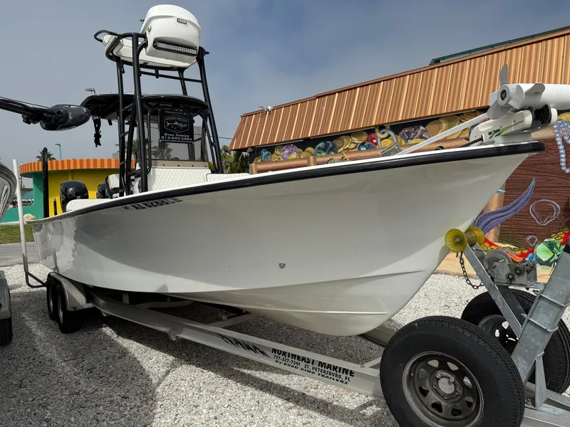 Slide: The Image of 2021 C-Hawk 25 Center Console boat on trailer, parked outdoors. - 4