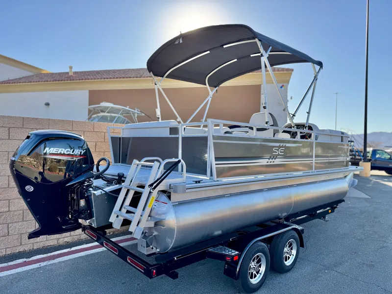 Slide: The Image of 2025 Berkshire 20 CRSE pontoon boat with Mercury engine on trailer. - 5