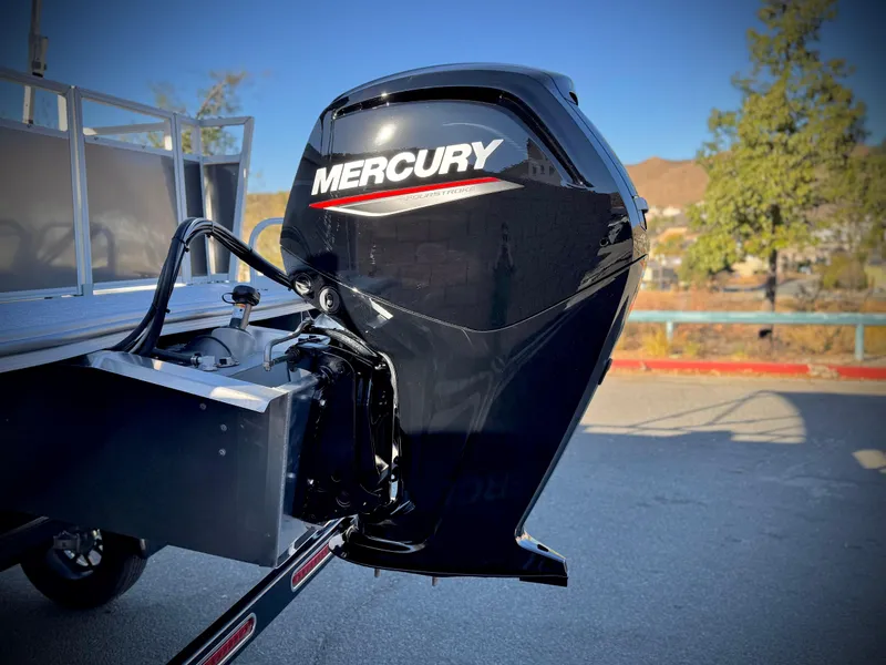 Slide: The Image of Mercury outboard motor on 2025 Berkshire 20 CRSE boat, parked outdoors. - 6