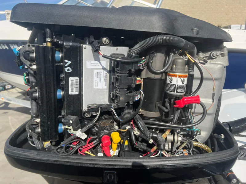 Slide: The Image of Open engine compartment of a 2005 Nitro NX 882 DC boat, showing wiring and components. - 13
