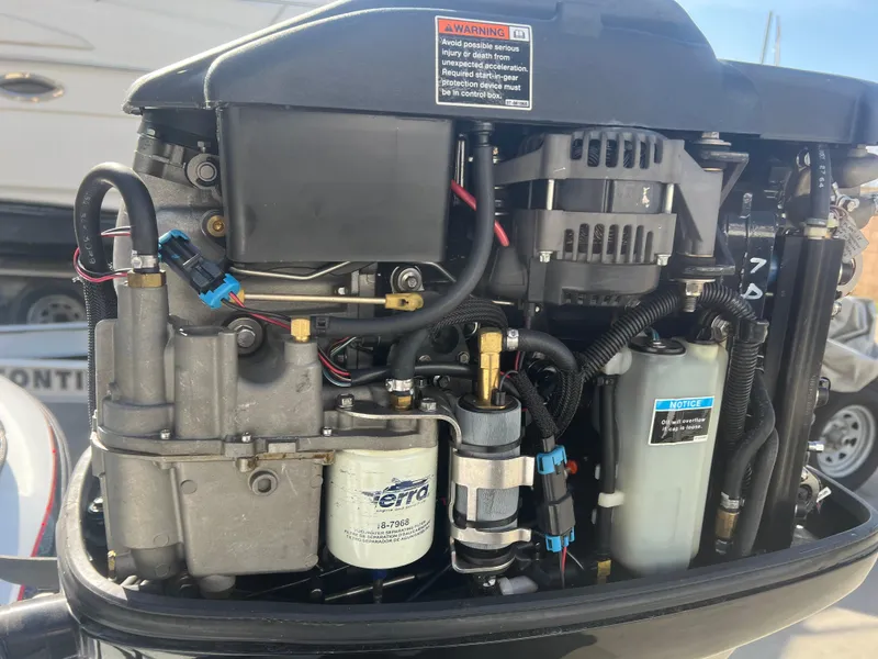 Slide: The Image of Close-up of a 2005 Nitro NX 882 DC boat engine, showcasing intricate mechanical components. - 14