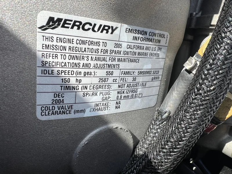 Slide: The Image of Mercury engine emission control label on a 2005 Nitro NX 882 DC boat. - 16