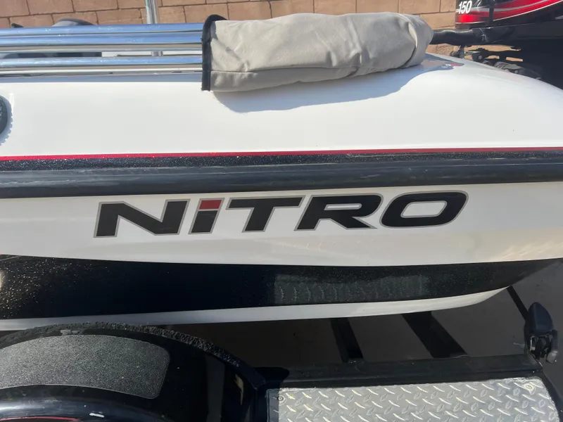 Slide: The Image of 2005 Nitro NX 882 DC boat with logo, white and black design. - 23