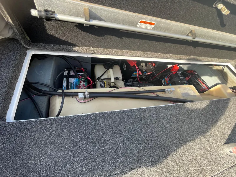 Slide: The Image of 2005 Nitro NX 882 DC boat battery compartment with wiring and components. - 27