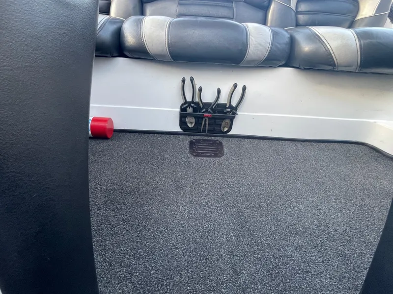 Slide: The Image of Interior of a 2005 Nitro NX 882 DC boat, featuring seating and carpeted flooring. - 29