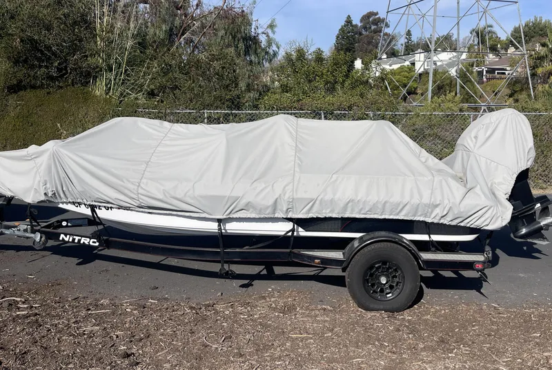 Slide: The Image of Covered 2005 Nitro NX 882 DC boat on trailer, parked outdoors. - 3