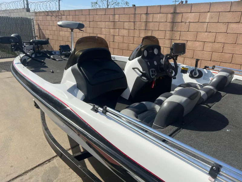 Slide: The Image of 2005 Nitro NX 882 DC boat with dual consoles and seating, parked outdoors. - 4