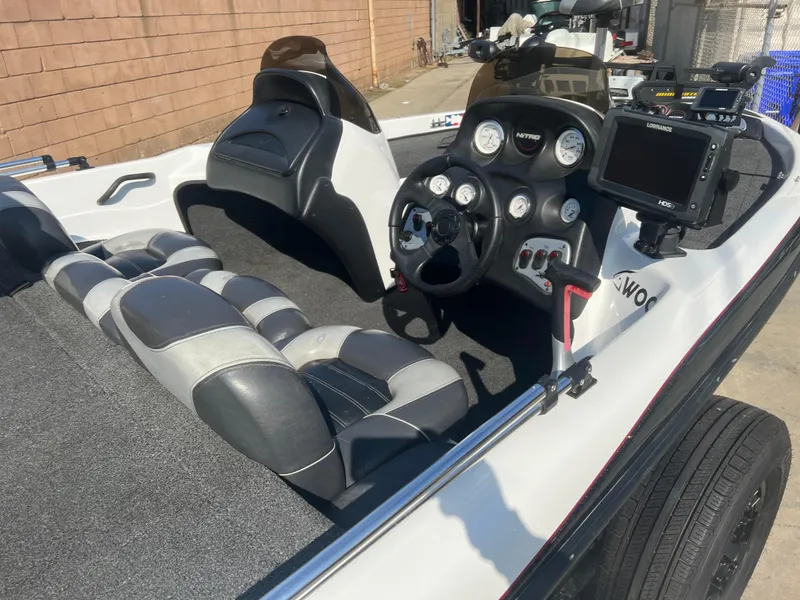 Slide: The Image of 2005 Nitro NX 882 DC boat interior with steering wheel and dashboard controls. - 6