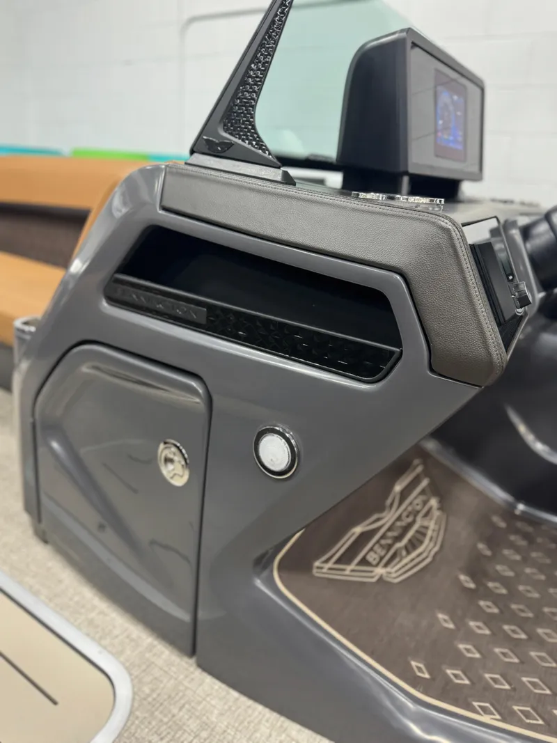 Slide: The Image of 2025 Bennington 24 MFB boat interior with luxurious captain's chair and modern dashboard. - 11