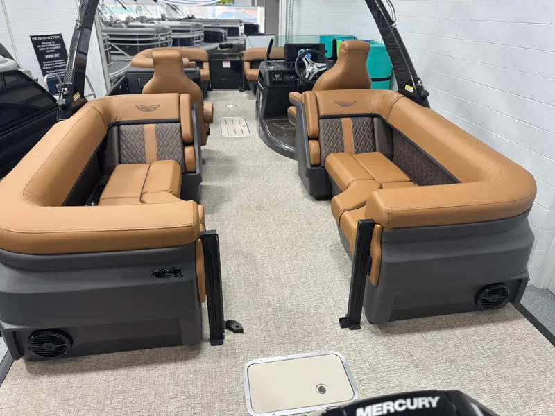 Slide: The Image of 2025 Bennington 24 MFB boat interior with luxurious brown and tan seating. - 16