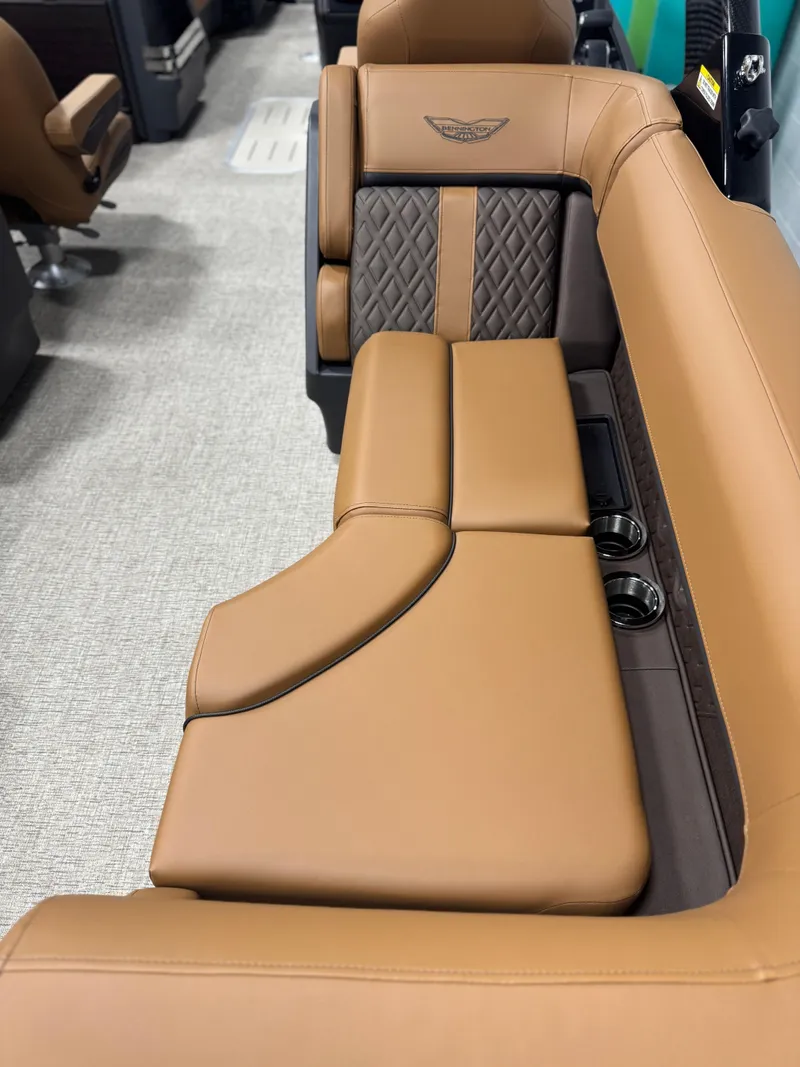 Slide: The Image of 2025 Bennington 24 MFB pontoon boat with luxurious tan seating and modern interior design. - 17
