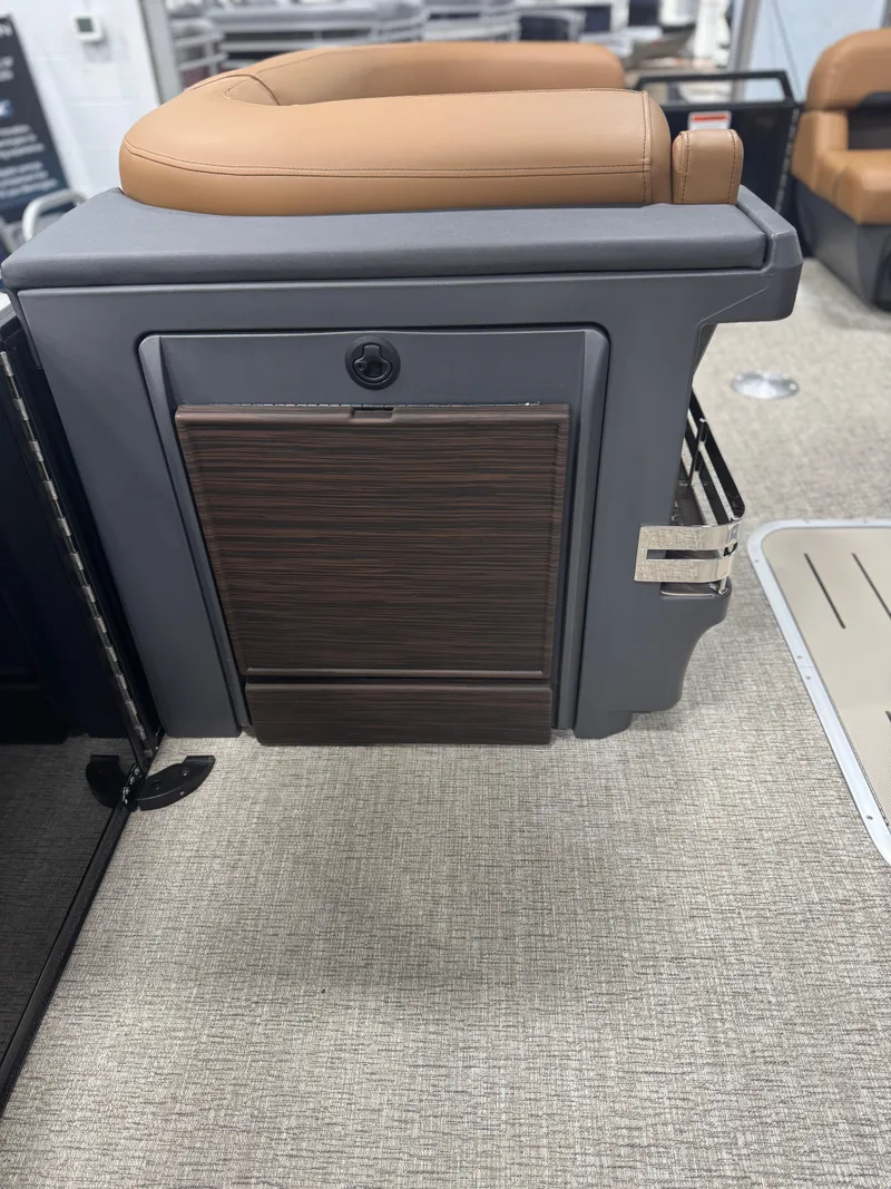 Slide: The Image of 2025 Bennington 24 MFB boat interior with tan seating and modern design elements. - 21