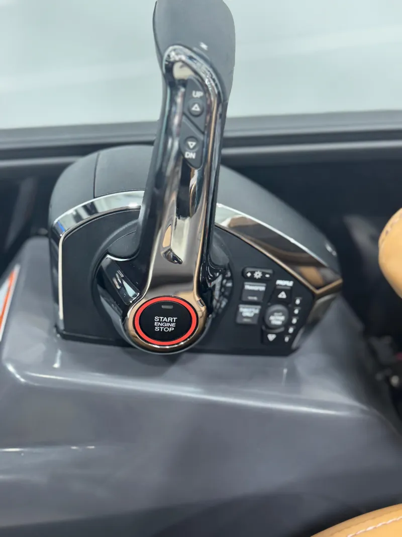 Slide: The Image of 2025 Bennington 24 MFB boat interior with cushioned seating and storage compartment. - 22