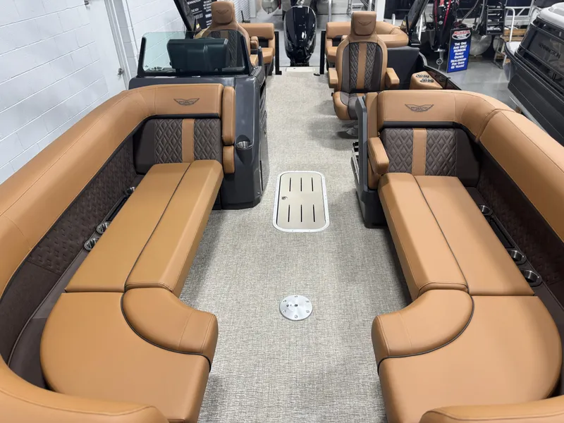 Slide: The Image of Luxury seating in 2025 Bennington 24 MFB boat with cup holders and premium upholstery. - 7