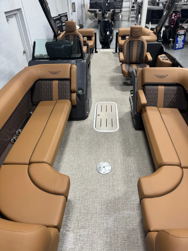 Slide: The Image of 2025 Bennington 24 MFB boat interior with luxurious tan seating and modern design. - 8