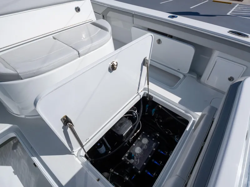 Slide: The Image of 2023 Yellowfin 36 Center Console boat with open storage compartment, showcasing interior details. - 22