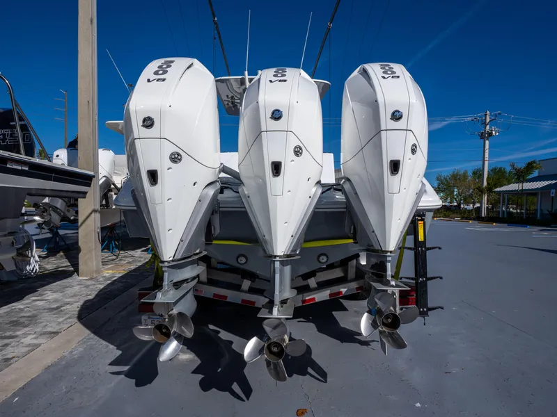 Slide: The Image of 2023 Yellowfin 36 Center Console with triple outboard engines on trailer. - 24