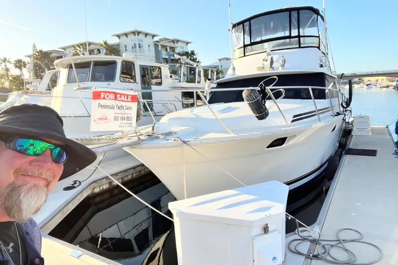 Slide: The Image of 1982 Silverton 37 Convertible yacht for sale at marina dock. - 6