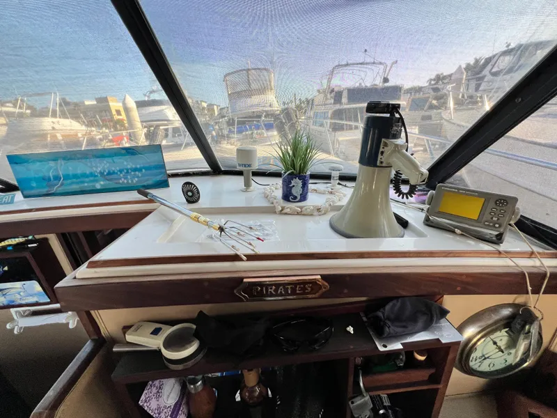 Slide: The Image of 1982 Silverton 37 Convertible boat interior with nautical decor and navigation equipment. - 8